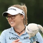 Brooke Henderson holding trophy after LPGA Tour victory, Canadian professional golfer major champion