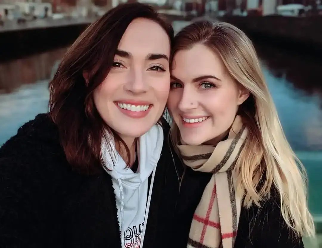 Rose Ellen Dix and Rosie Spaughton, British lesbian YouTube couple and LGBTQ+ content creators smiling together